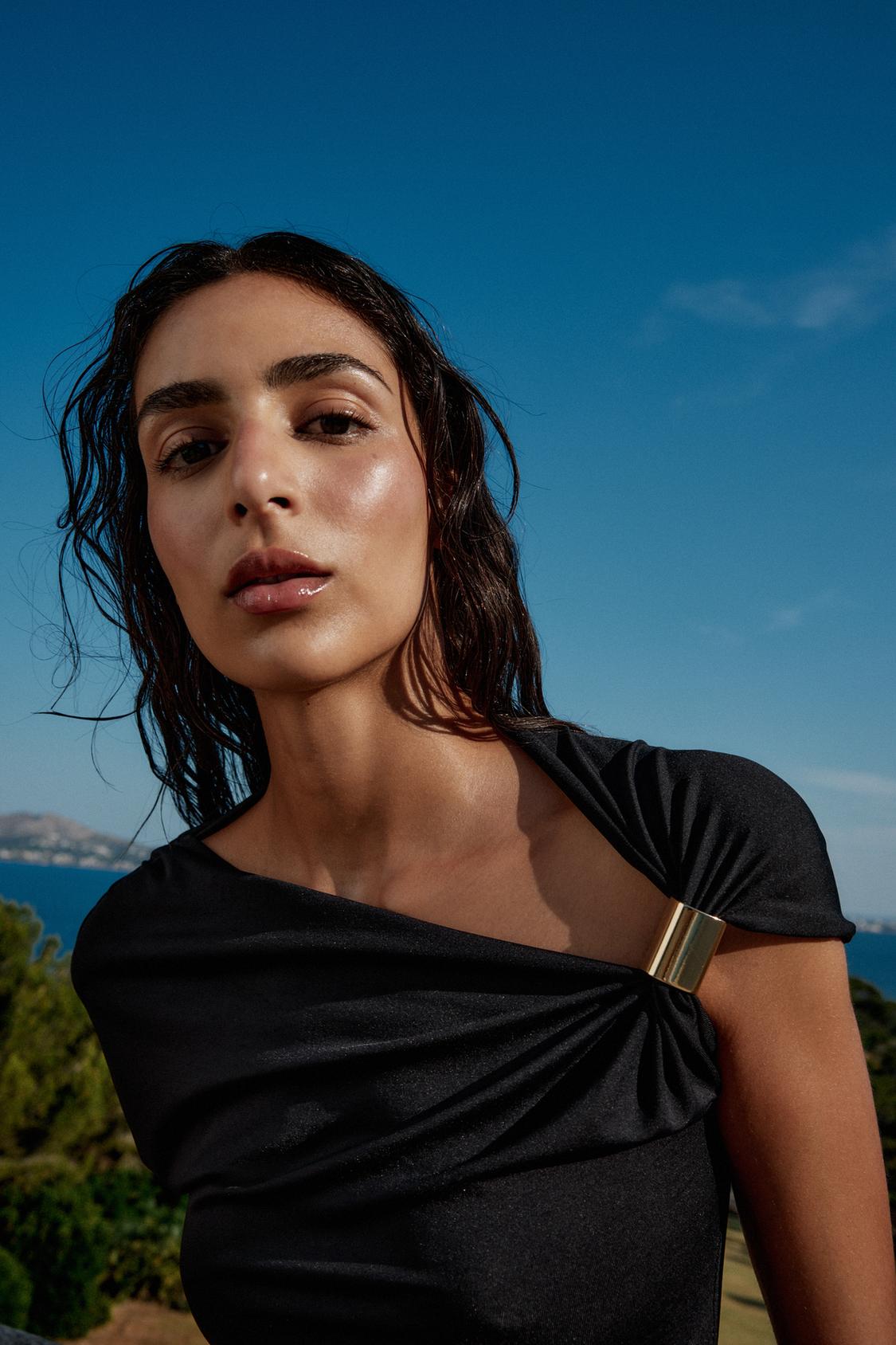 Disha Patani Luxe Asymmetric Buckle Bliss Top