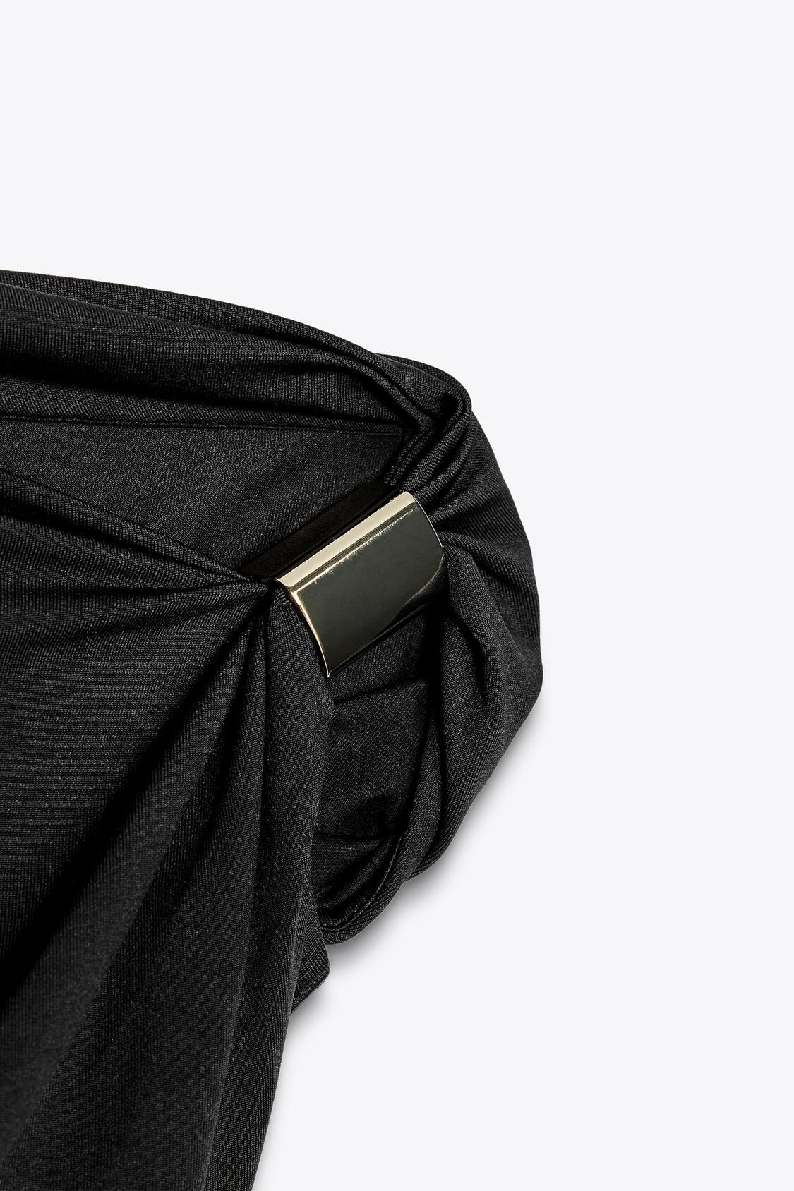 Disha Patani Luxe Asymmetric Buckle Bliss Top