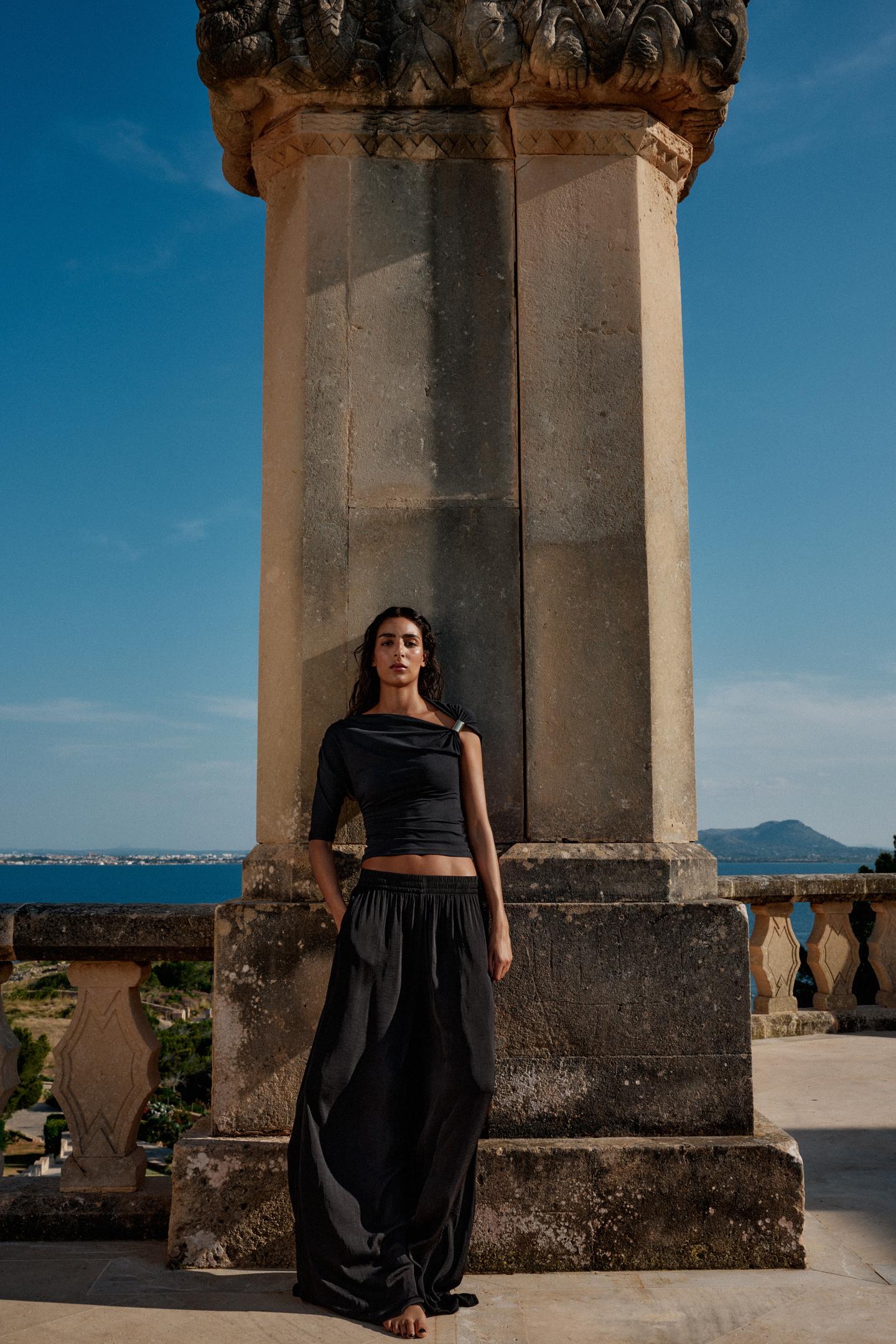 Disha Patani Luxe Asymmetric Buckle Bliss Top