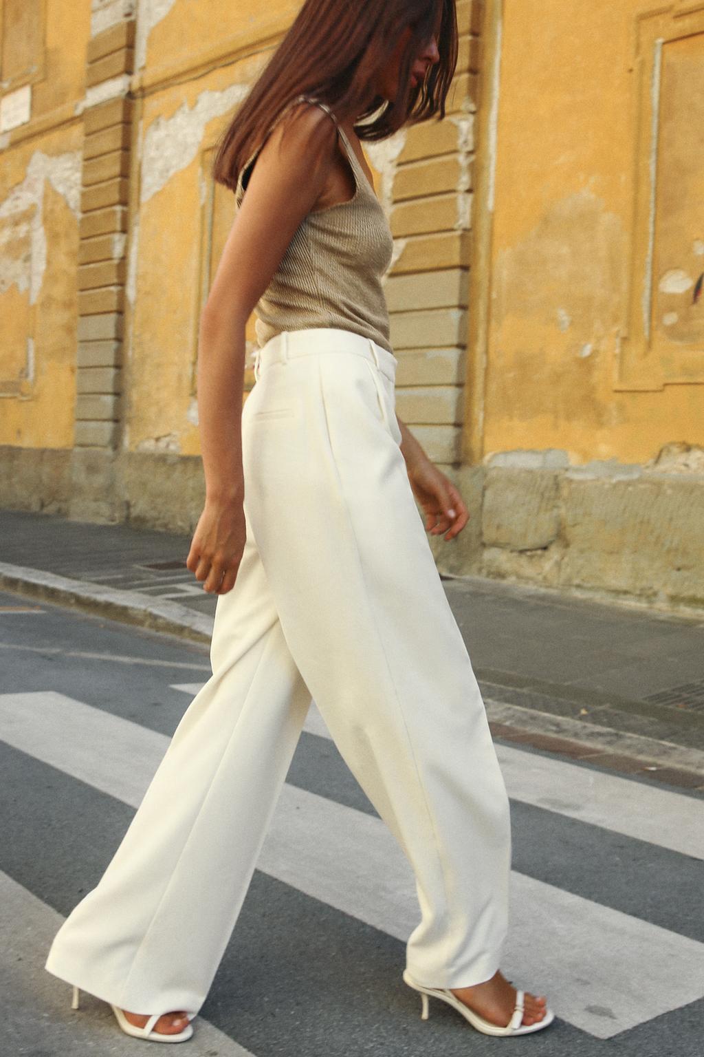 OFF-WHITE PLEATED TROUSERS