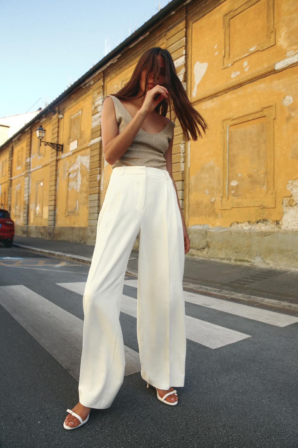 OFF-WHITE PLEATED TROUSERS