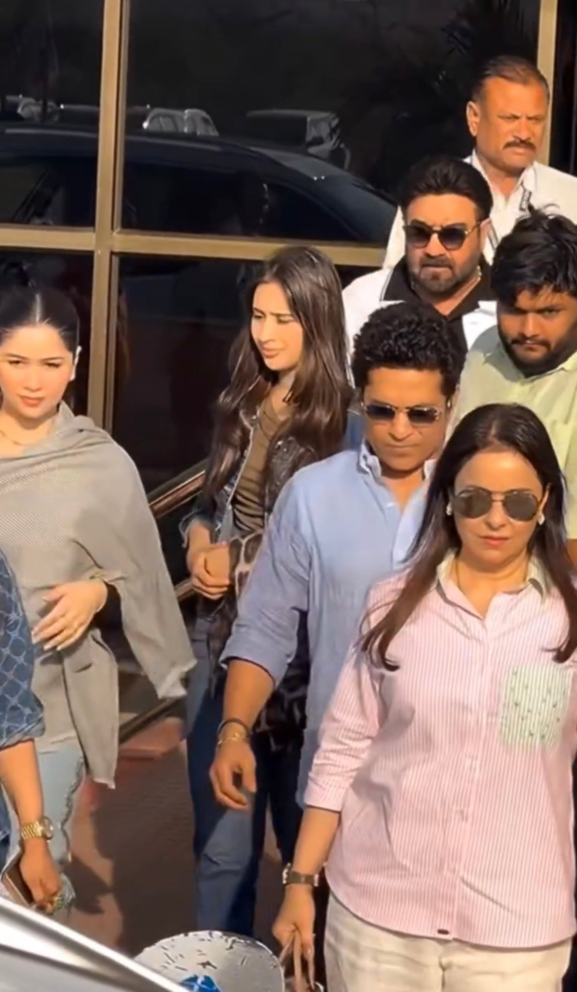 anjali tendulkar pink stripped shirt with beads