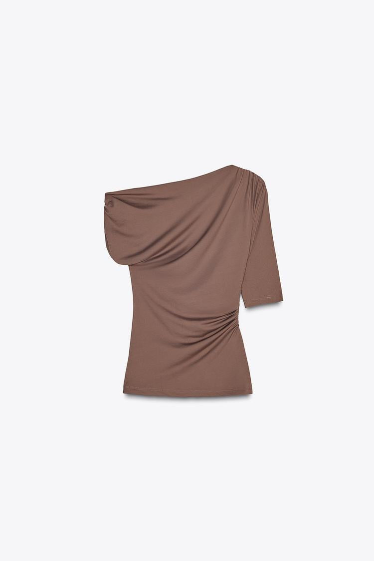 Disha Patani Luxe Asymmetric Buckle Bliss Top